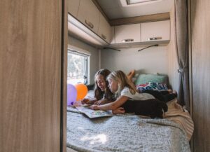 Two kids playing on a camping trip