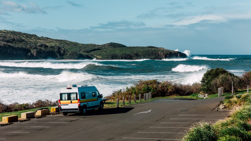 Campervan parked at surf spot on South Coast in winter