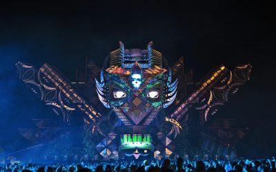 Tomorrowland festival in Boom Belgium with colourful stages, crowds and camping area, showing where people stay during the event.