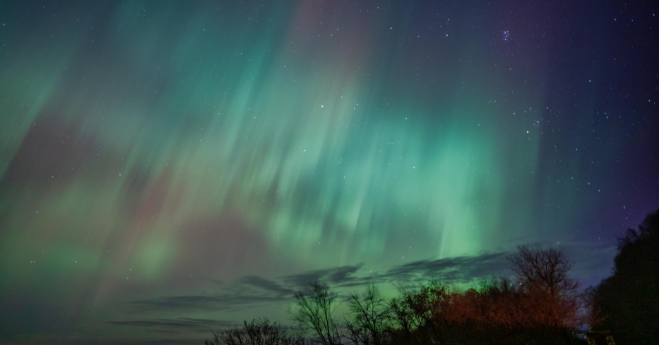 Chase the aurora australis in a campervan across New Zealand and Australia. Best spots, forecast apps, and why a campervan beats a hotel for southern lights chasing.
