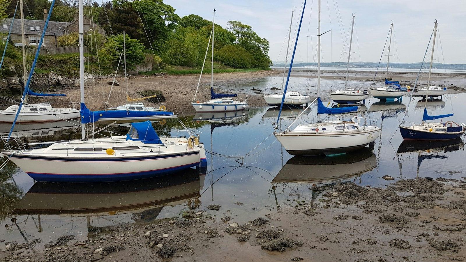 Sailing boats at low tide in Cramond harbour, Edinburgh