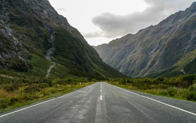 Milford Road winding between mountains in Fiordland, New Zealand